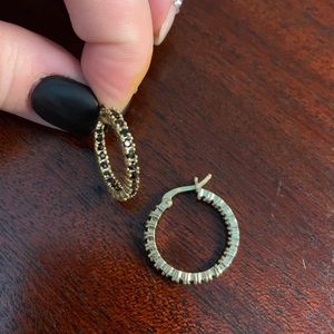 Gold hoop earrings with black stones